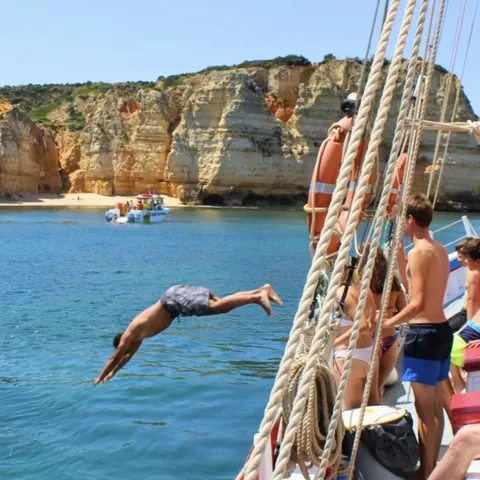 Traditional sailboat heading toward the Ponta da Piedade caves