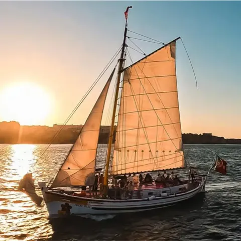 Traditional sailboat at sunset in Lagos